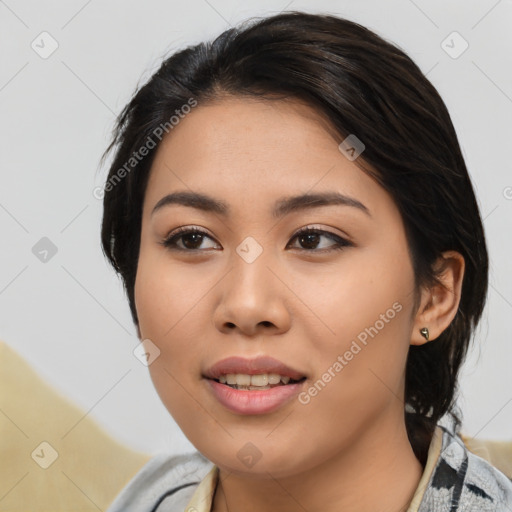 Joyful asian young-adult female with medium  black hair and brown eyes