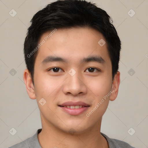 Joyful asian young-adult male with short  black hair and brown eyes