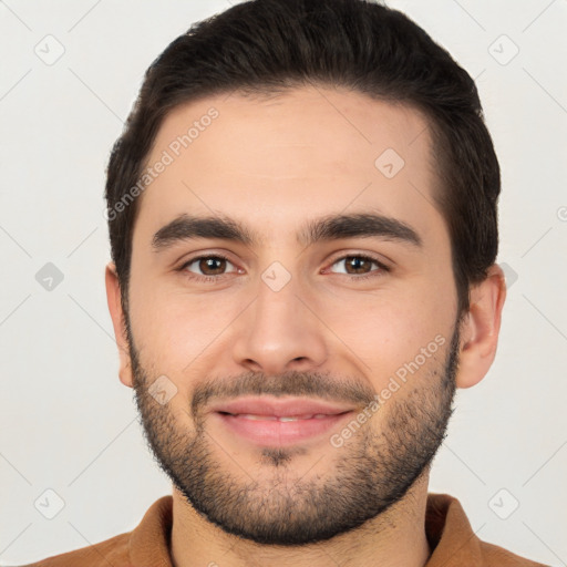 Joyful white young-adult male with short  brown hair and brown eyes