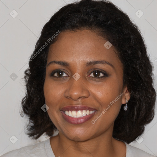 Joyful black young-adult female with medium  brown hair and brown eyes