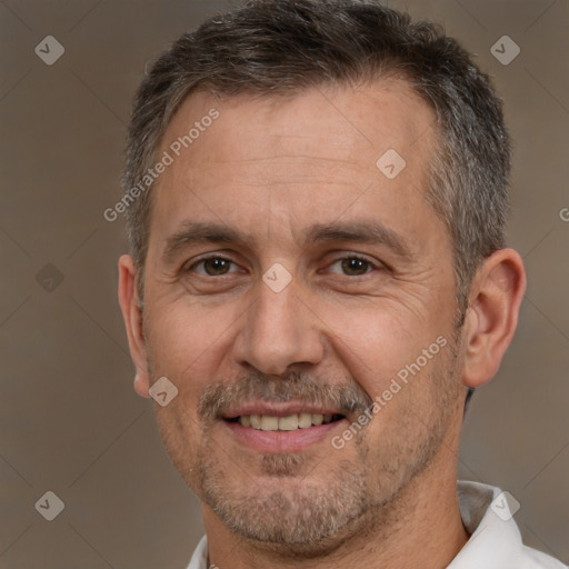 Joyful white adult male with short  brown hair and brown eyes