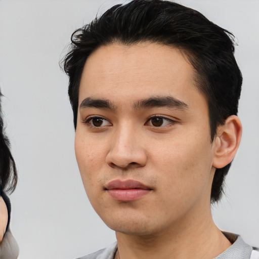 Neutral white young-adult male with short  black hair and brown eyes