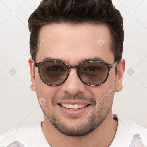 Joyful white young-adult male with short  brown hair and brown eyes