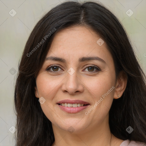 Joyful white adult female with long  brown hair and brown eyes