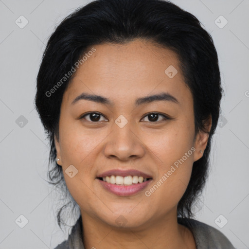 Joyful asian young-adult female with medium  black hair and brown eyes