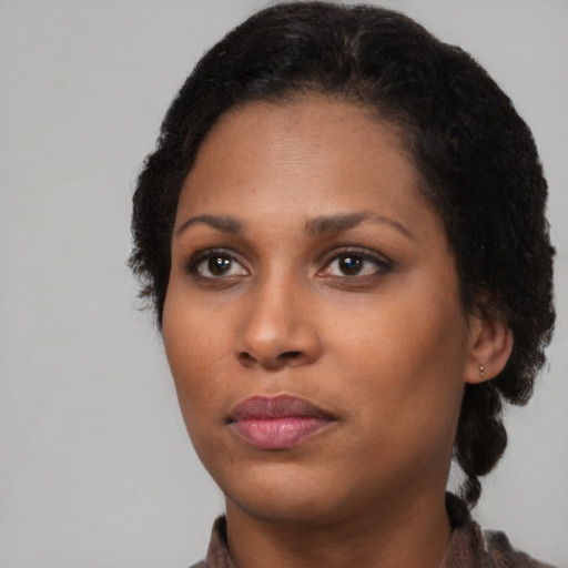 Neutral black young-adult female with short  black hair and brown eyes