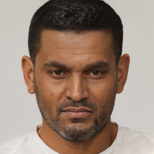 Neutral black adult male with short  black hair and brown eyes