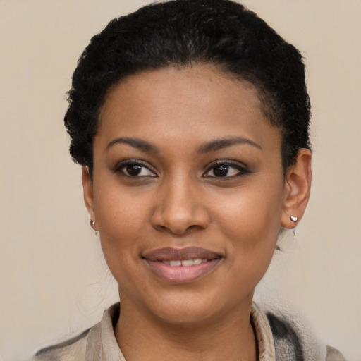 Joyful latino young-adult female with short  black hair and brown eyes