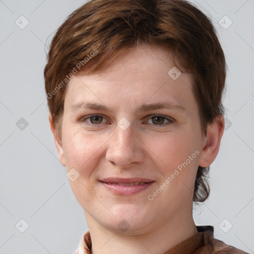 Joyful white young-adult female with short  brown hair and grey eyes