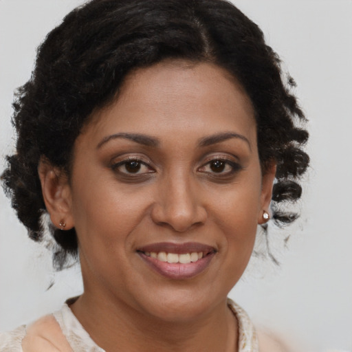 Joyful black young-adult female with medium  brown hair and brown eyes
