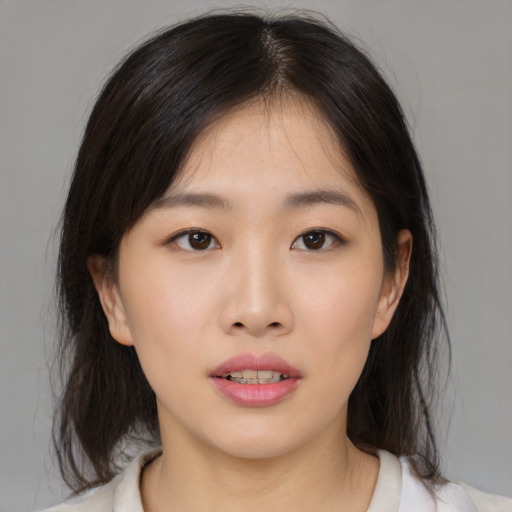 Neutral asian young-adult female with medium  brown hair and brown eyes