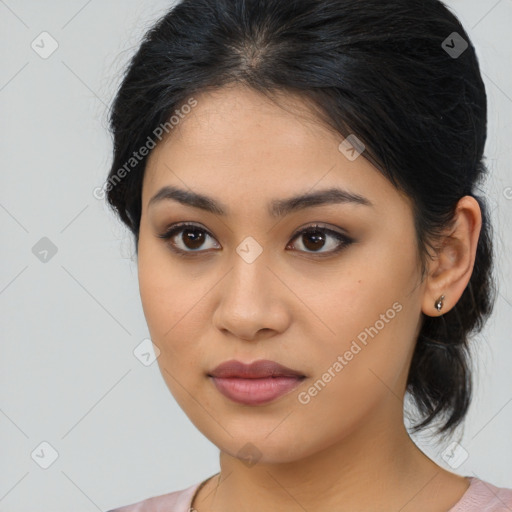 Joyful latino young-adult female with medium  brown hair and brown eyes