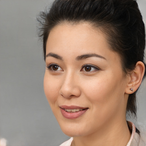 Joyful asian young-adult female with medium  brown hair and brown eyes