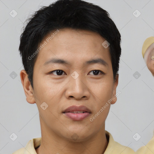 Joyful asian young-adult male with short  black hair and brown eyes