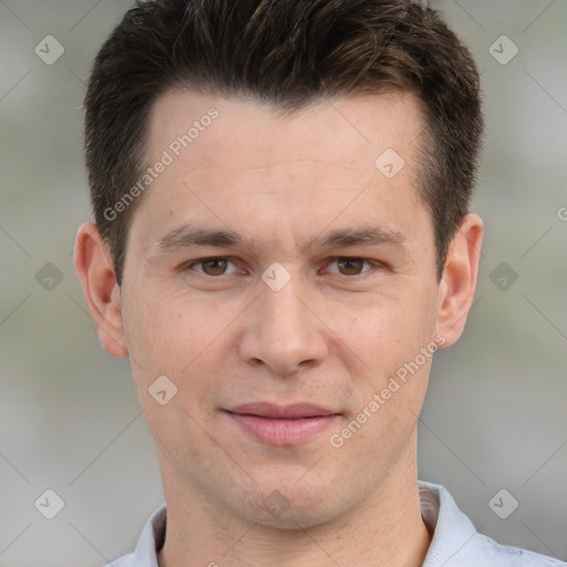 Joyful white adult male with short  brown hair and brown eyes