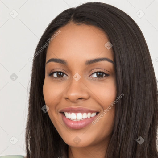 Joyful latino young-adult female with long  black hair and brown eyes