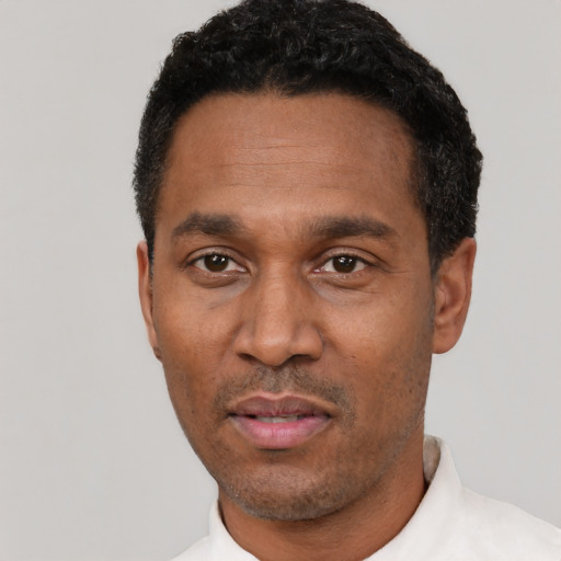 Neutral latino adult male with short  black hair and brown eyes