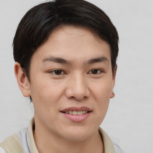 Joyful asian young-adult female with short  brown hair and brown eyes