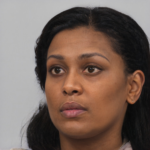 Neutral black young-adult female with medium  black hair and brown eyes