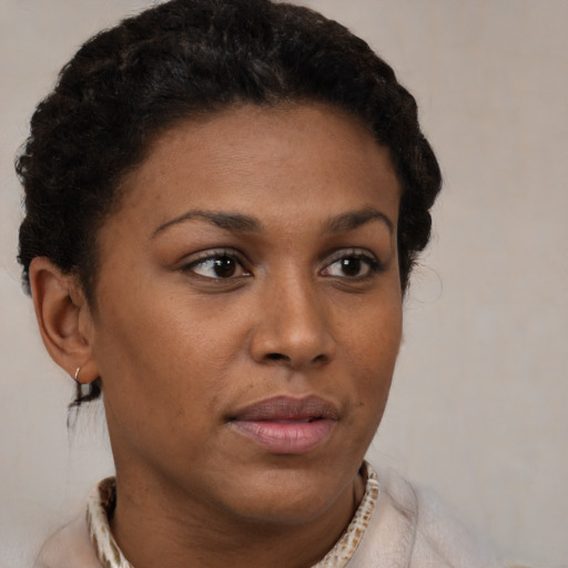 Neutral black young-adult female with short  brown hair and brown eyes