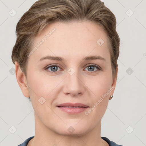 Joyful white young-adult female with short  brown hair and grey eyes