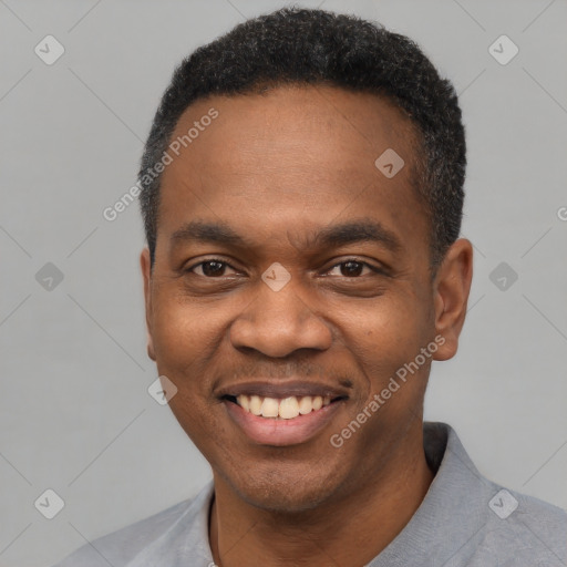 Joyful black young-adult male with short  black hair and brown eyes