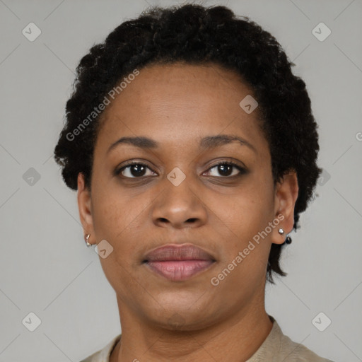 Joyful black young-adult female with short  brown hair and brown eyes