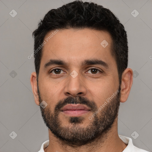 Neutral white young-adult male with short  black hair and brown eyes