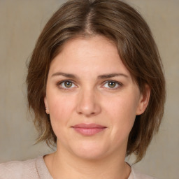 Joyful white young-adult female with medium  brown hair and green eyes