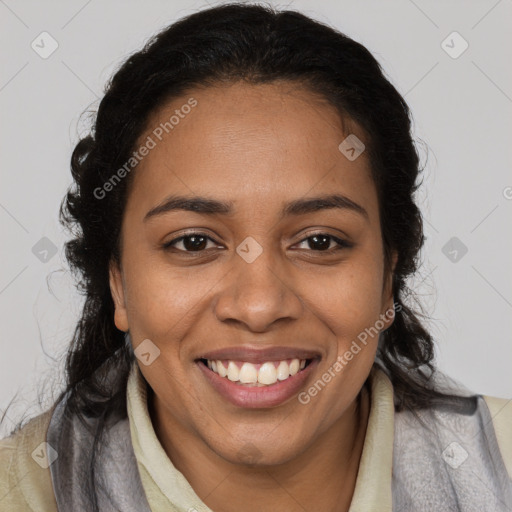 Joyful black young-adult female with long  brown hair and brown eyes