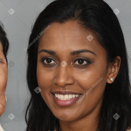 Joyful latino young-adult female with medium  brown hair and brown eyes