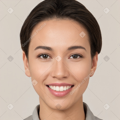 Joyful white young-adult female with short  brown hair and brown eyes