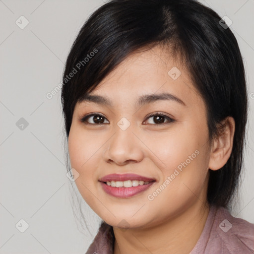 Joyful asian young-adult female with medium  black hair and brown eyes