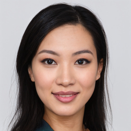 Joyful white young-adult female with long  black hair and brown eyes