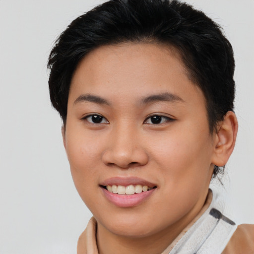 Joyful asian young-adult female with short  brown hair and brown eyes