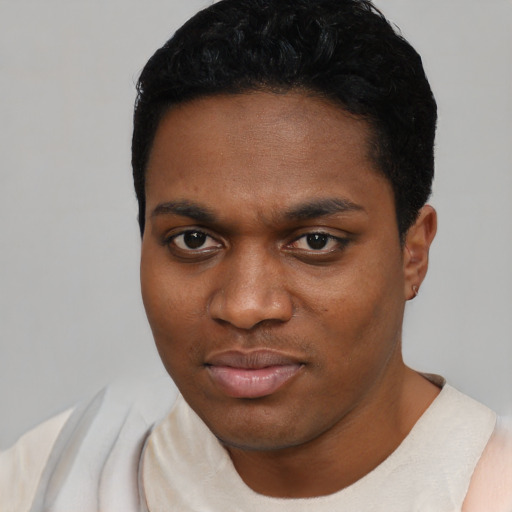 Neutral black young-adult male with short  black hair and brown eyes