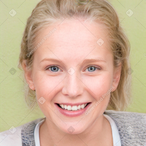 Joyful white young-adult female with medium  brown hair and blue eyes