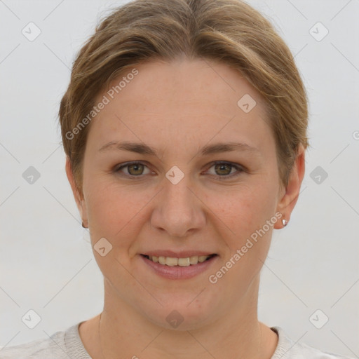 Joyful white young-adult female with short  brown hair and grey eyes