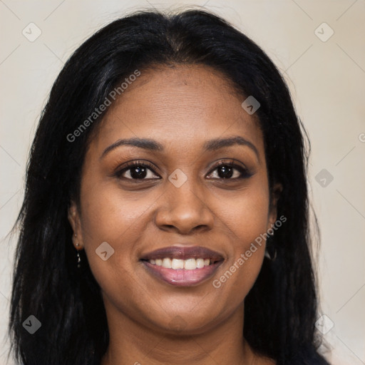 Joyful black young-adult female with long  brown hair and brown eyes