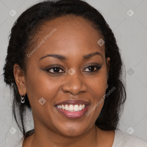 Joyful black young-adult female with medium  brown hair and brown eyes