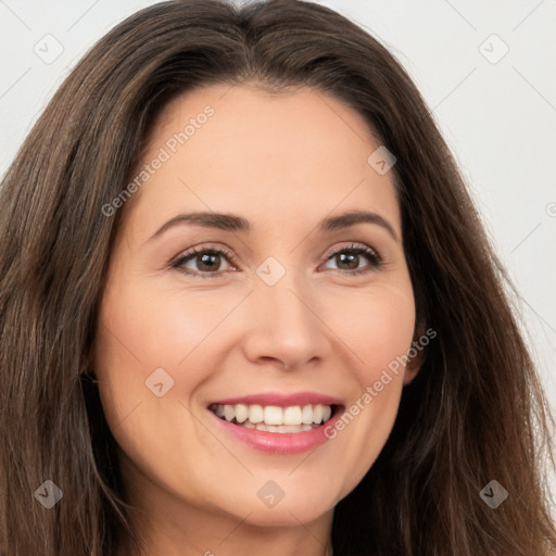 Joyful white young-adult female with long  brown hair and brown eyes