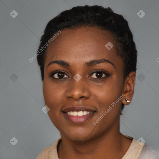 Joyful black young-adult female with short  black hair and brown eyes