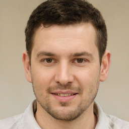 Joyful white young-adult male with short  brown hair and brown eyes