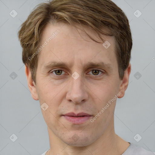 Joyful white adult male with short  brown hair and grey eyes