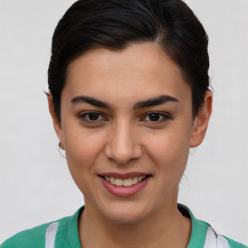 Joyful asian young-adult female with short  brown hair and brown eyes
