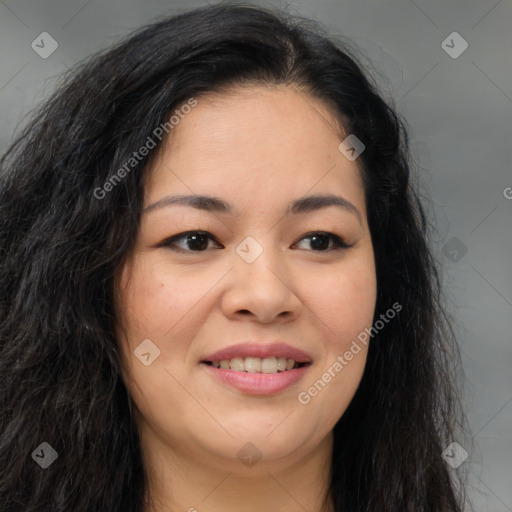 Joyful asian young-adult female with long  brown hair and brown eyes