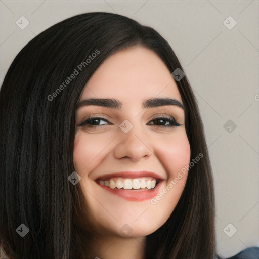 Joyful white young-adult female with long  black hair and brown eyes