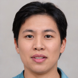 Joyful asian young-adult male with short  black hair and brown eyes