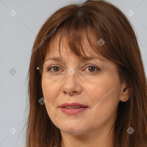 Joyful white adult female with long  brown hair and brown eyes