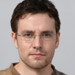 Neutral white adult male with short  brown hair and grey eyes